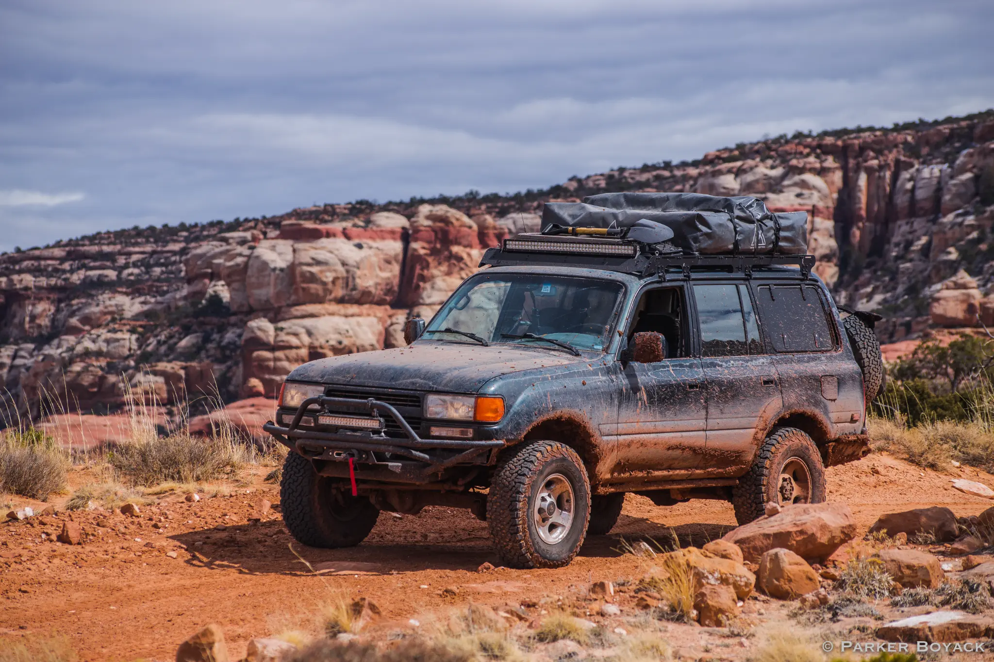 FZJ80 Land Cruiser outfitted with a dashcam, LED light bar, and winch