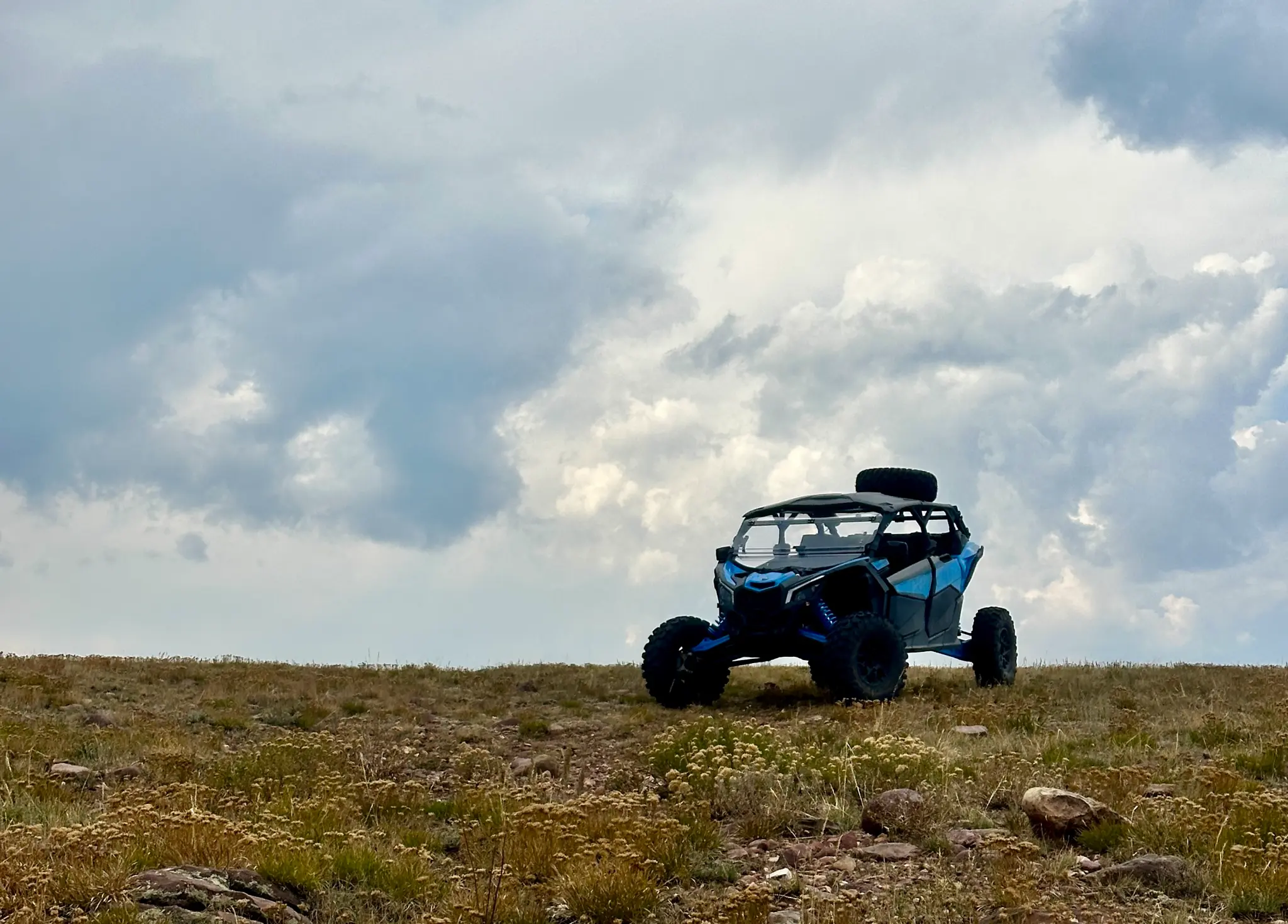 Can-Am Maverick RR with a rear mirror camera and stereo upgrade
